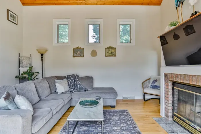 Indulge in comfort and style in our living room, featuring plush sofas, and elegant chairs. Cozy up by the fireplace, and unwind with entertainment on the TV.