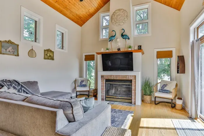 Indulge in comfort and style in our living room, featuring plush sofas, and elegant chairs. Cozy up by the fireplace, and unwind with entertainment on the TV.