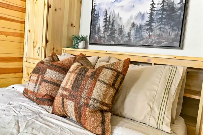 Relax in style with a plush queen bed, ample storage in surrounding built-in wardrobes.