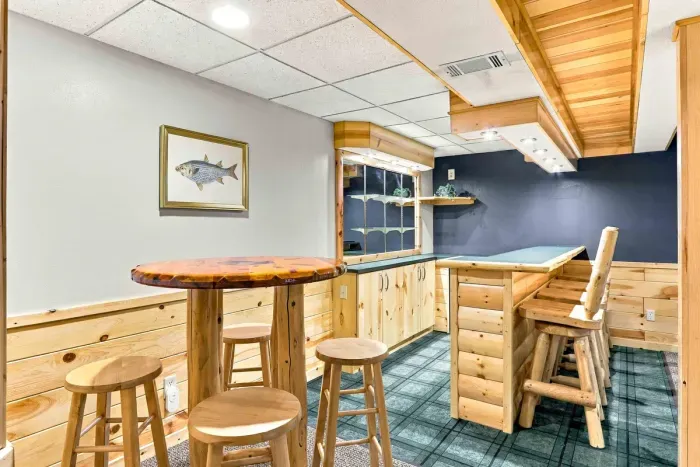 Pull up a seat at the handcrafted high-top bar table for late-night snacks or conversation in the basement entertainment area.
