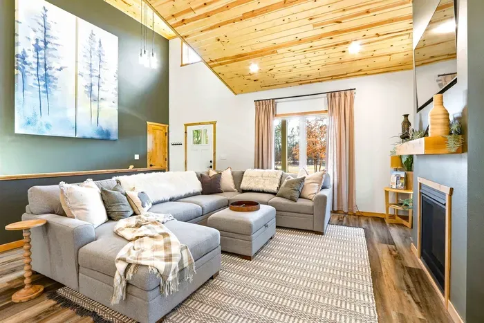 Sunlit Living Space with Fireplace, TV & Cozy Seating