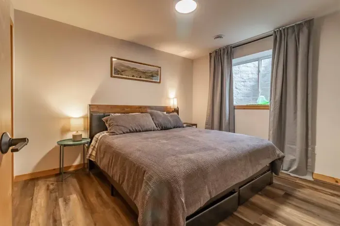 A cozy bedroom featuring elegant gray bedding that adds a modern, soothing touch for a comfortable night’s rest.