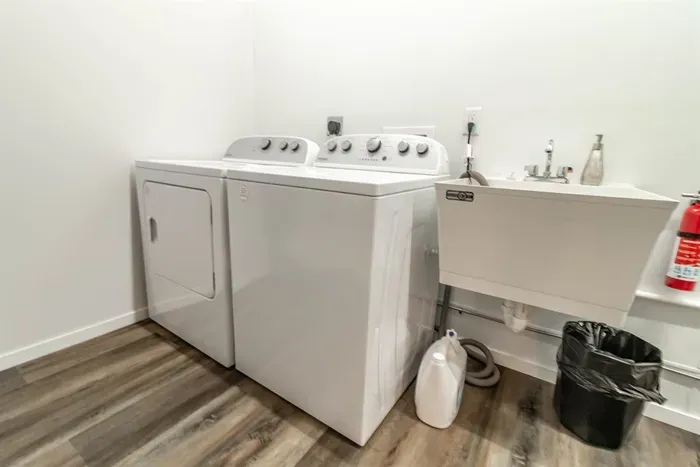 A practical laundry area equipped with a washer and dryer, making longer stays convenient and hassle-free.