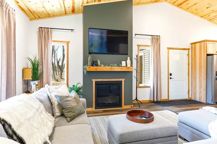 Inviting Lounge with Fireplace, Couch & Smart TV