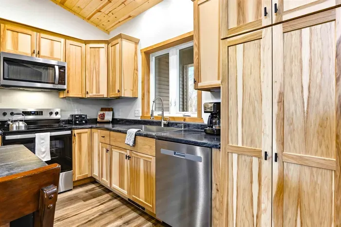 Spacious Kitchen with Wooden Cabinets & Prep Counter