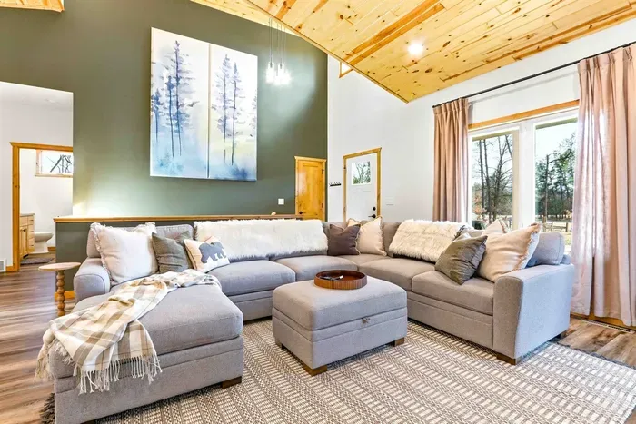 Sunlit Living Space with Fireplace, TV & Cozy Seating