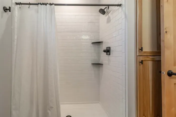 A comfortable bathroom with both a shower and a bathtub, perfect for quick refreshes or relaxing soaks.