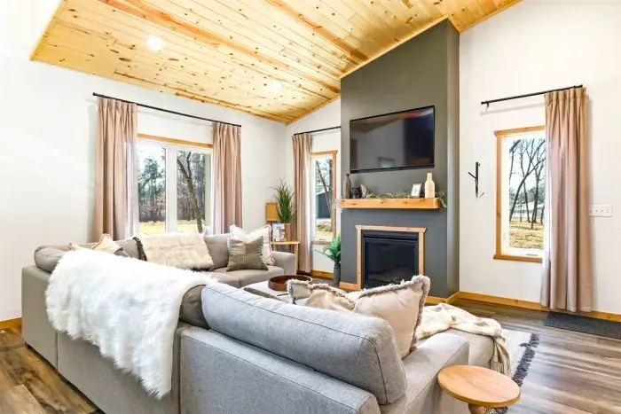 Bright Lounge with Fireplace, Couch & Big Windows