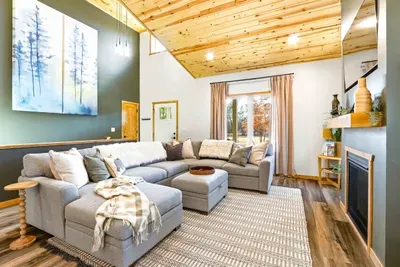 Warm Living Room with Couch, Fireplace & TV