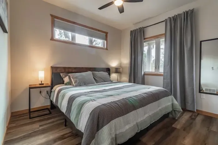 Bright, airy bedroom with clean white walls that create a fresh and calming atmosphere.