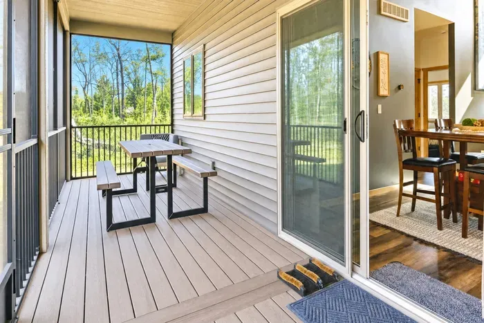 Your screened porch connects directly to the dining room — slide the door open and dinner moves outside in thirty seconds. Bug-free, breeze included.