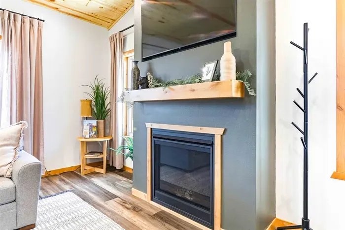 Comfortable Living Room with Fireplace & Bright Windows