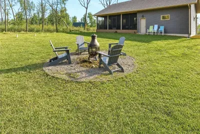 Your this is where the best memories get made — crackling fire, Adirondack chairs, and nothing but trees in every direction. Your group will end up here every single night.