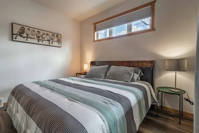 Bright, airy bedroom with clean white walls that create a fresh and calming atmosphere.