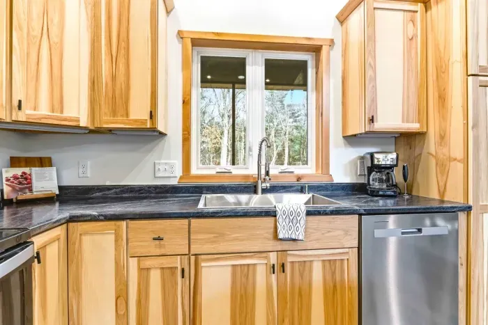Fully Equipped Kitchen with Wooden Cabinets & Center Counter
