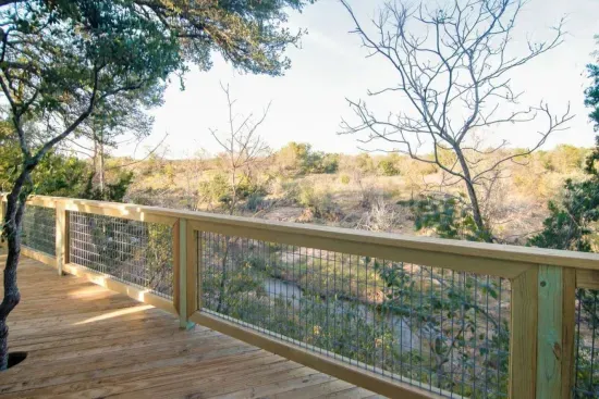 View from the deck: perched on a bluff about thirty feet above Palo Alto creek, the deck is the best place to take in the views and sounds of the Texas Hill Country.