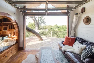 Glass overhead door from living room onto upper deck.