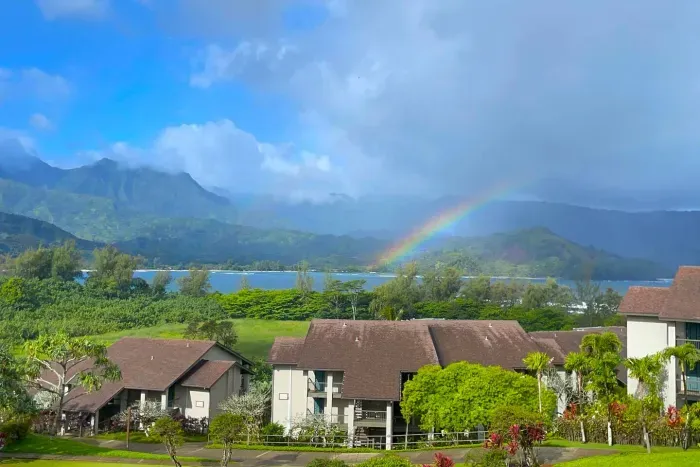 Rainbows galore, set against the mountain backdrop ! 