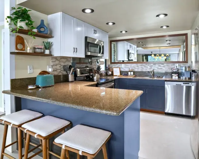 Kitchen + Bar Seating
 Modern comfort meets island ease. A fully stocked vacation rental condo with everything you need to cook, unwind, and connect.