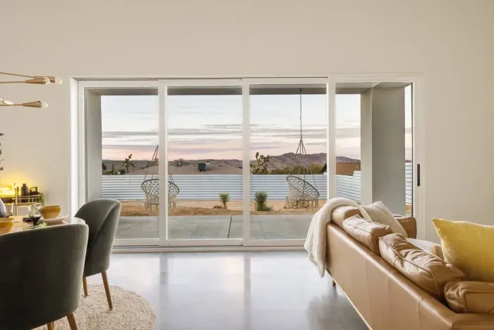 Stunning views - Large sliding doors open the living room to the desert landscape