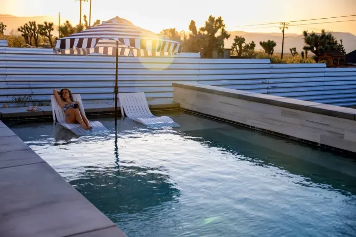  Desert glow, private pool + hot tub. Unwind under the striped umbrellas or take a sunset dip