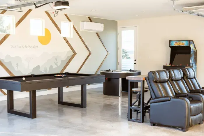 Our garage/gameroom has everything you'd ever want! Pool Table, 4 person air hockey, arcades, and a movie theater!