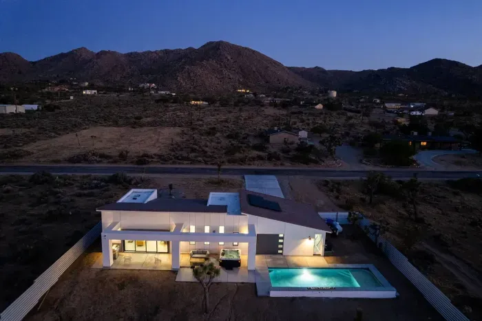 Desert minimalism meets modern indulgence — your private retreat glows softly against the mountains, where leisure is the lifestyle!