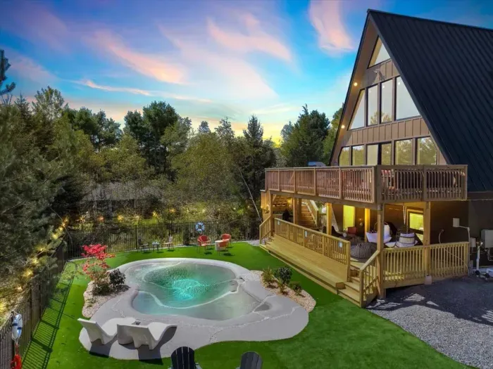 Backyard Oasis: Dive into relaxation with a private pool, lush lawn, and stunning sunset views!
