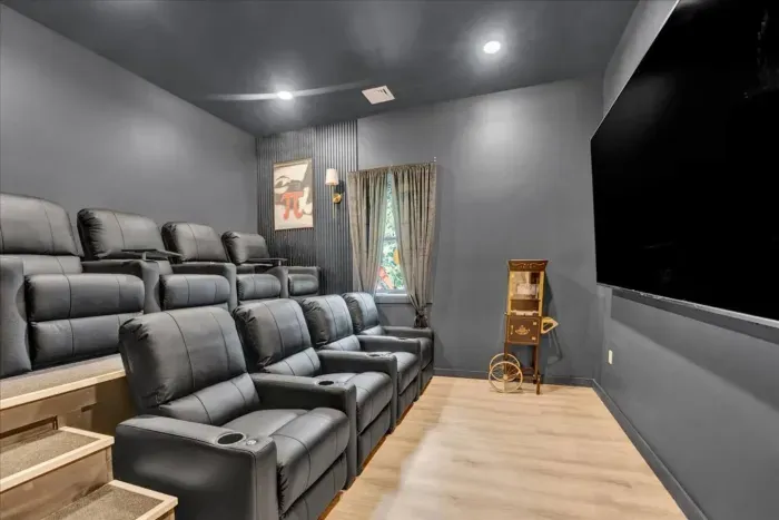 Home Theater: Experience cinematic magic in plush seating with a giant screen and vintage flair!