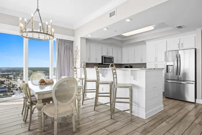 Dining area seats 6 with additional seating for 3 at breakfast bar