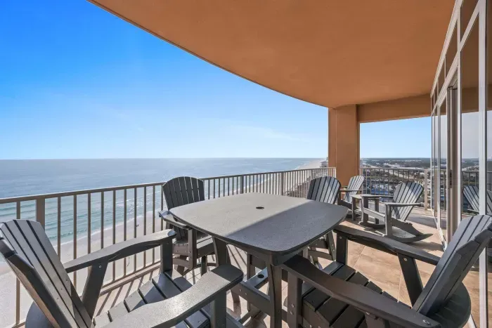 Balcony has Gulf views with table and chairs for 4 plus 2 adirondack chairs