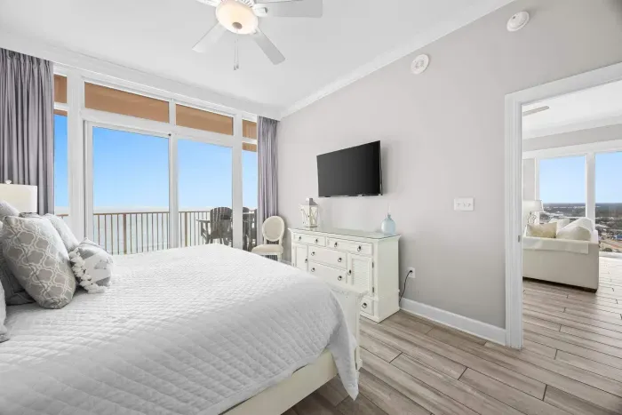 Primary bedroom with balcony access