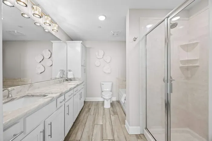 Primary bathroom with walk in shower and large soaking tub