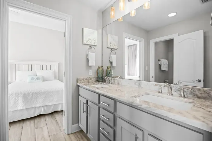 Adjoining bathroom connects guest bedrooms