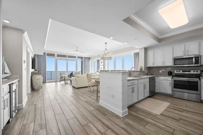 Kitchen area overlooks dining area and living room