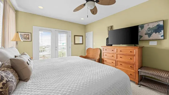 Primary bedroom with balcony access