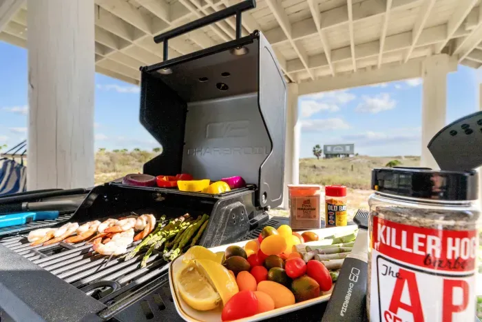 Grill up fresh Gulf flavors beneath the house, where the shaded concrete slab keeps cookouts cool and convenient.
