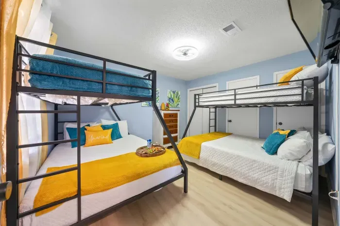Second Guest Bedroom: Perfect for families or groups, this room features two sets of queen-over-twin bunk beds for plenty of space and comfort.