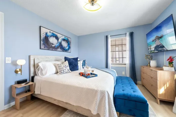 Primary Bedroom: A king-size bed sets the tone for peaceful nights and unhurried mornings.