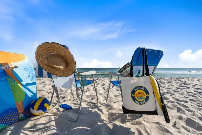 Beach-ready amenities: chairs, sand toys, boogie boards, and a cart provided for your convenience.