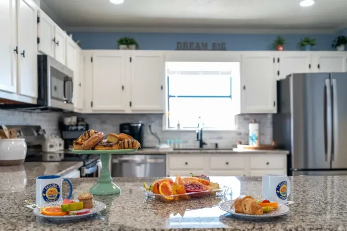 Kitchen: Bright and breezy, with a breakfast bar for four. Where relaxed mornings and shared meals begin.