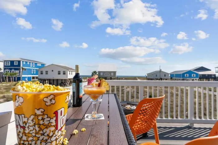 Cocktails, conversations, and Gulf views — the sun deck bar is the place to be.