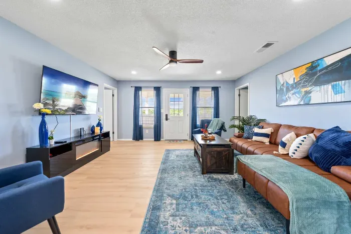 Living Room: A warm and inviting space with a view of the front door that sets the tone for your stay the moment you step inside.