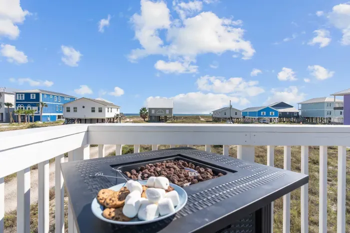 Back Sun Deck: Bar seating for four and a cozy gas fire pit set the stage for Gulf views by day and s’mores under the stars by night.