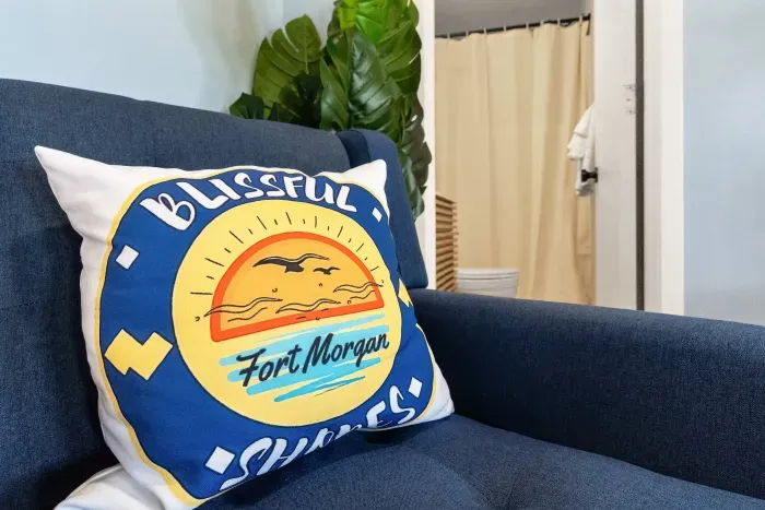 Living Room: A bright and inviting space to relax with the guest bathroom just steps away for added convenience during your stay.