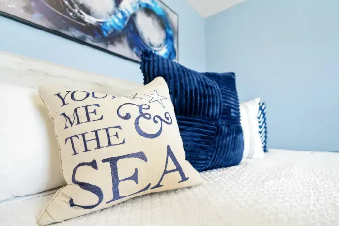 Settle into the comfort of a king bed with soft, plush bedding. The heart of this inviting primary bedroom.