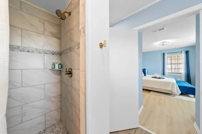 Primary Bathroom: Recently renovated with a spacious walk-in shower.