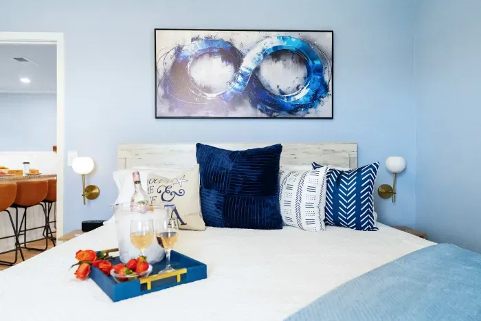 Primary Bedroom: A spacious king bed sets the stage for quiet evenings and dreamy mornings together.