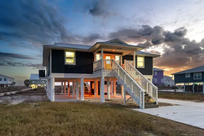 Blissful Shores at sunset, welcoming you home with warm coastal light and a peaceful end to the day.