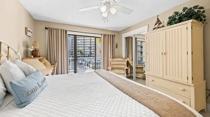 Primary bedroom with balcony access